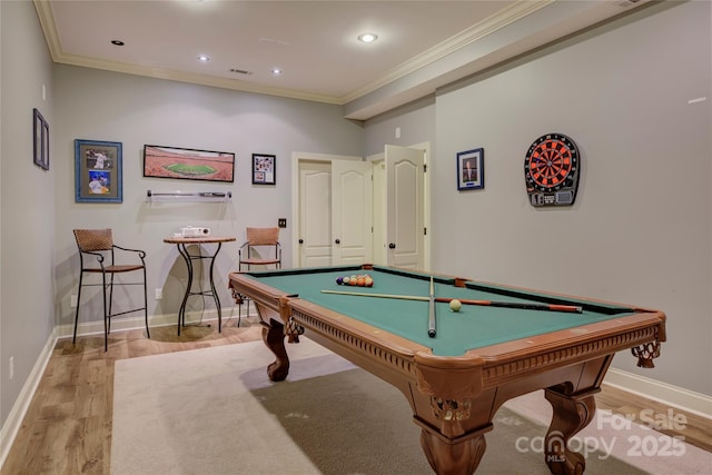 rec room with light hardwood / wood-style floors, ornamental molding, and billiards