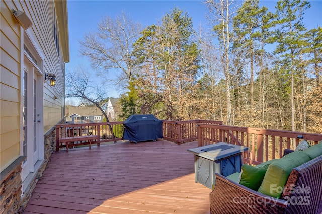 wooden deck featuring grilling area