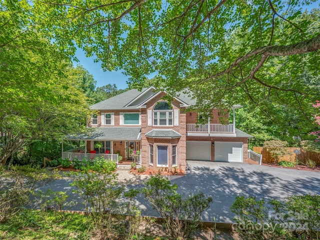 view of front of home with covered porch and a garage