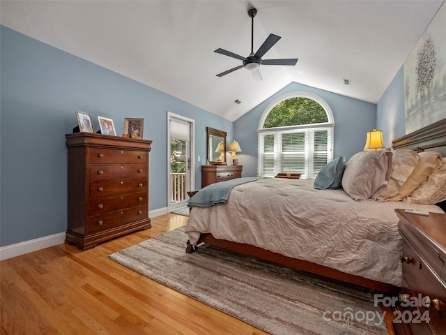 bedroom with access to exterior, light wood-type flooring, ceiling fan, and lofted ceiling