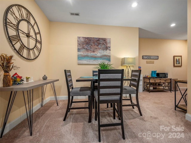 dining space with carpet