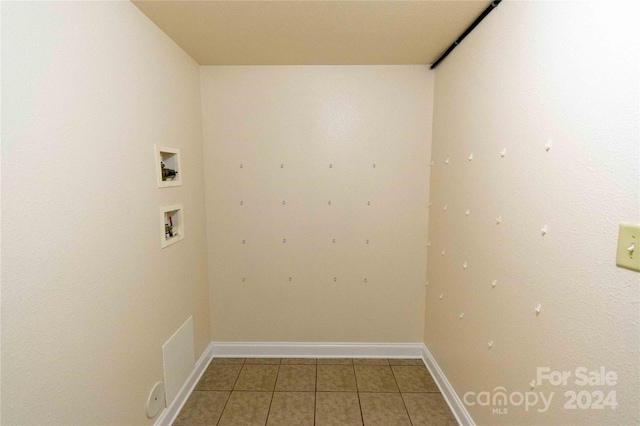 washroom featuring tile patterned floors and hookup for a washing machine