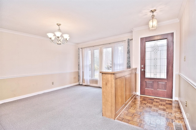 entrance foyer with crown molding, dark parquet floors, and a chandelier