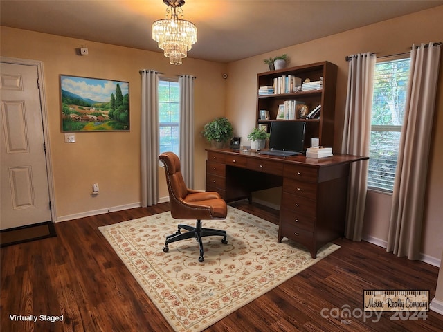 home office featuring dark wood-type flooring and a notable chandelier