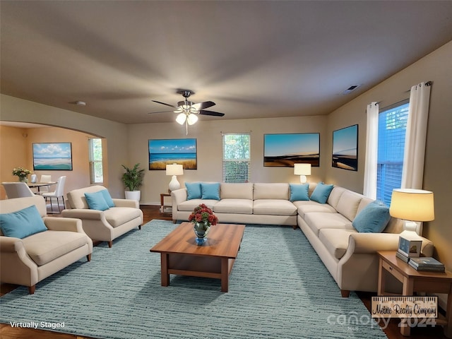 living room with ceiling fan, plenty of natural light, and hardwood / wood-style flooring