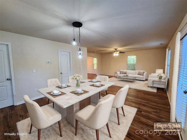 dining area with dark hardwood / wood-style floors and ceiling fan