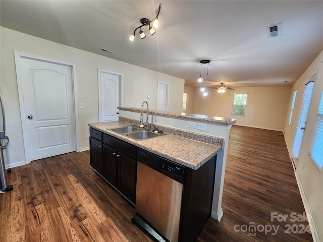 kitchen featuring ceiling fan, sink, decorative light fixtures, a center island with sink, and dishwasher