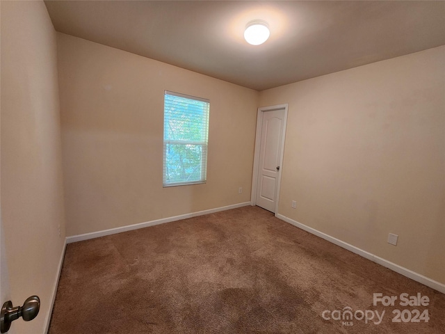 unfurnished room featuring carpet floors