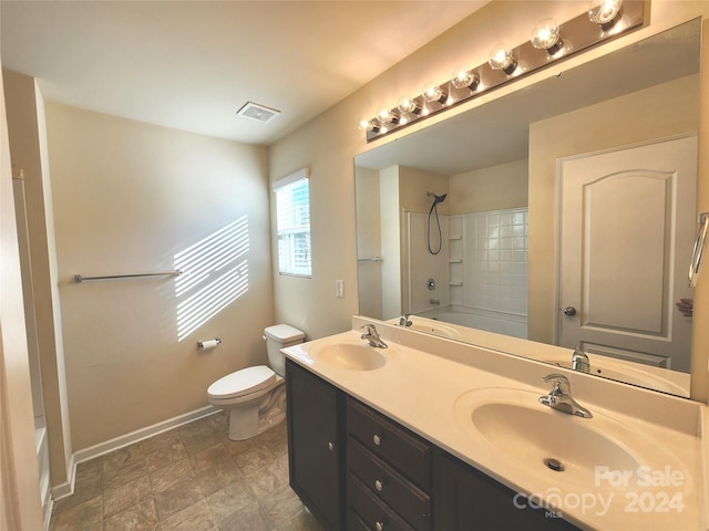 full bathroom with vanity, shower / bathtub combination, and toilet