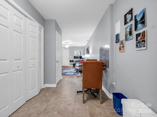 hallway featuring light tile patterned floors