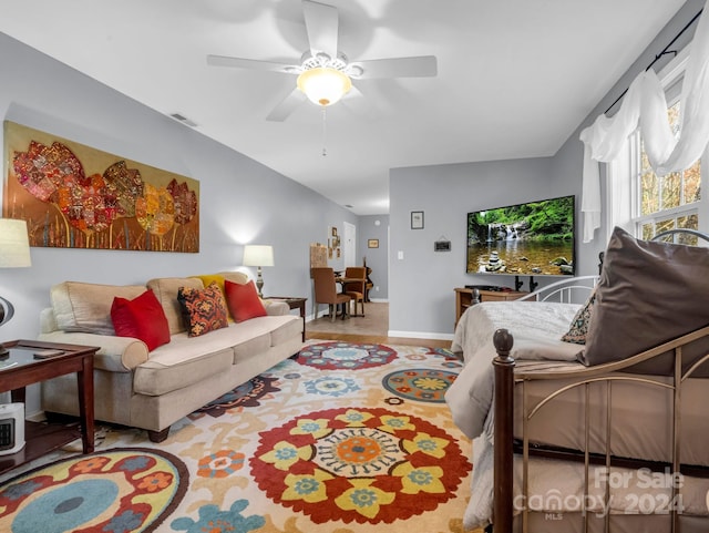 living room with vaulted ceiling and ceiling fan