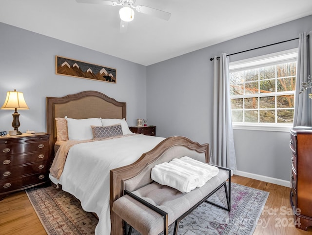 bedroom featuring light wood-type flooring and ceiling fan