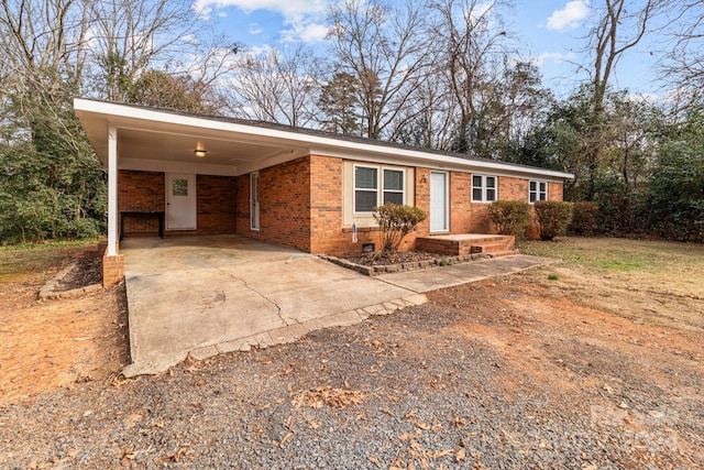 ranch-style home with a carport