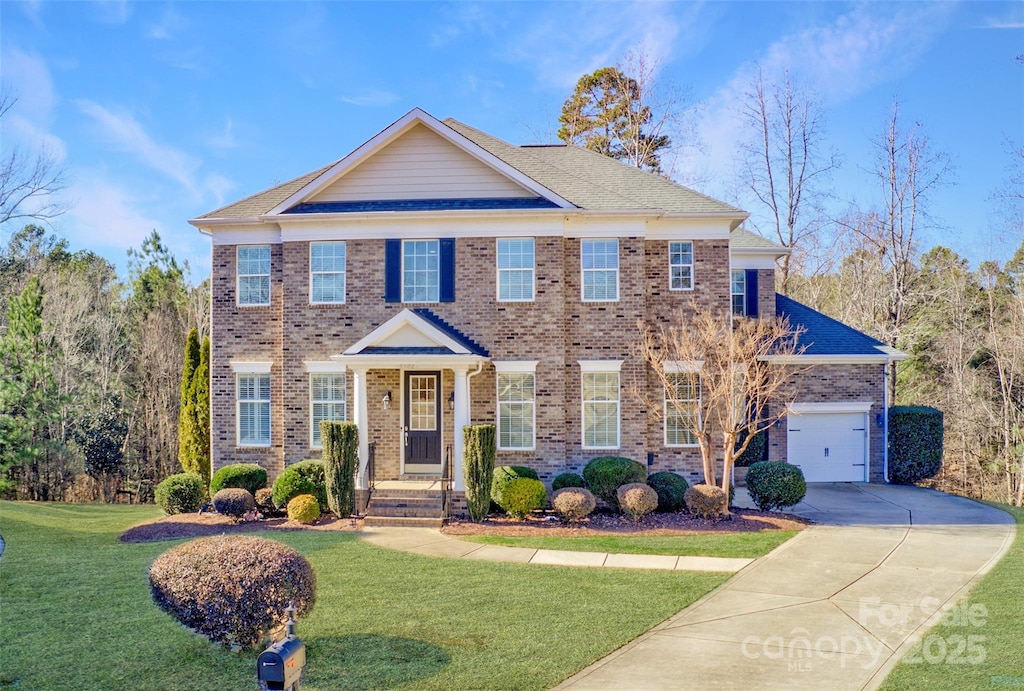 colonial home with a front yard