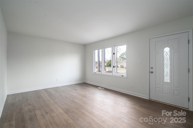 entryway with hardwood / wood-style flooring