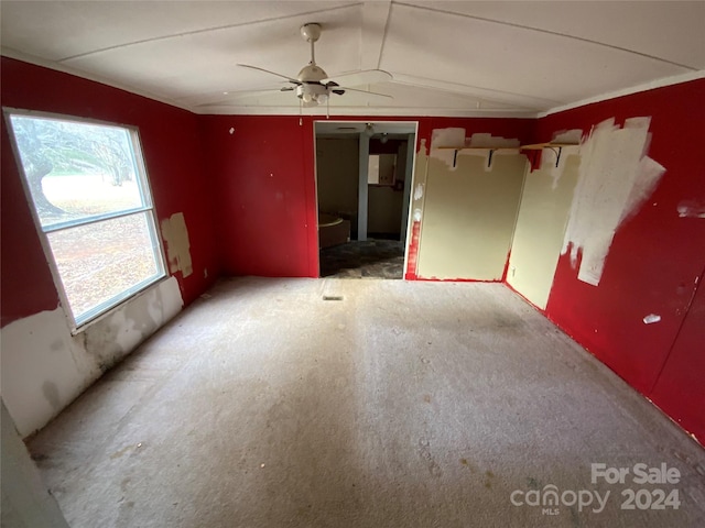 spare room with ceiling fan and lofted ceiling