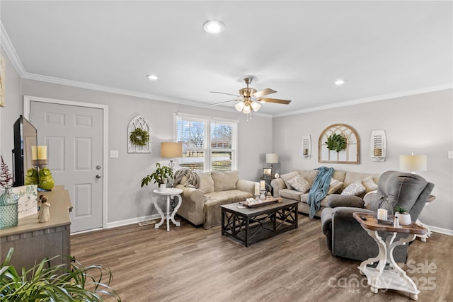 living room with crown molding, wood-type flooring, and ceiling fan