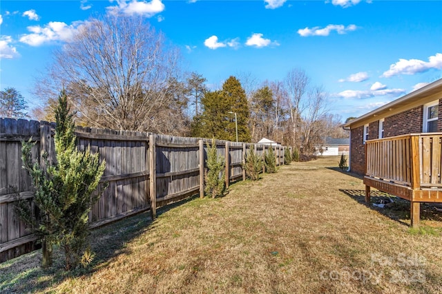 view of yard featuring a wooden deck