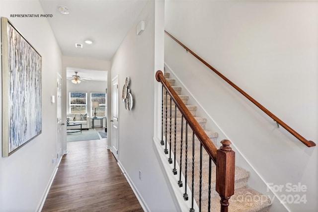 interior space featuring hardwood / wood-style floors and ceiling fan