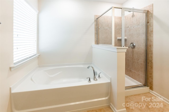 bathroom with shower with separate bathtub