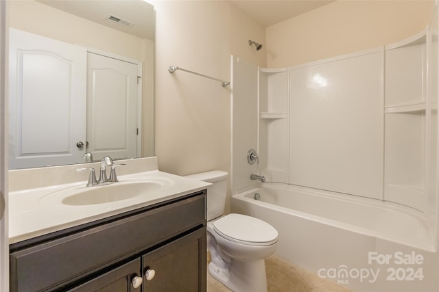 full bathroom featuring tile patterned floors, vanity, toilet, and shower / washtub combination