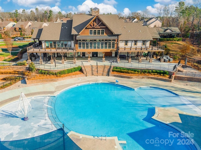 view of swimming pool with a patio area