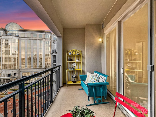 view of balcony at dusk