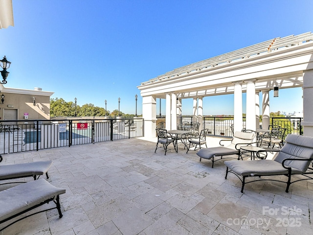 view of patio featuring a balcony