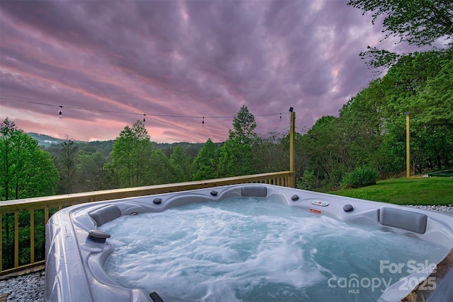 exterior space featuring a hot tub