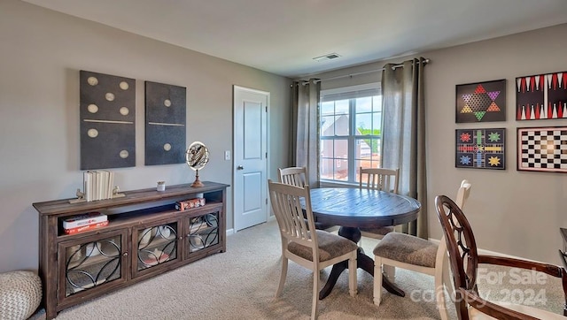 dining area with carpet flooring