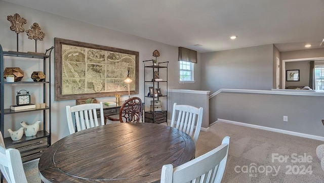 view of carpeted dining space