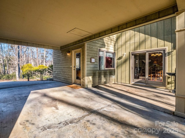 doorway to property with a patio