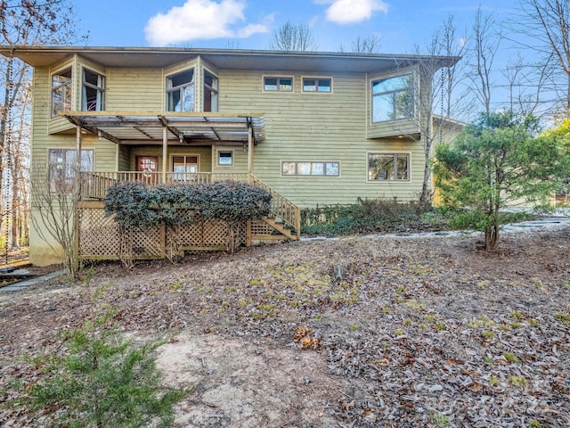 rear view of house featuring a pergola