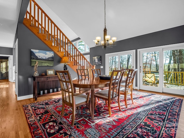 dining area with a chandelier and wood-type flooring