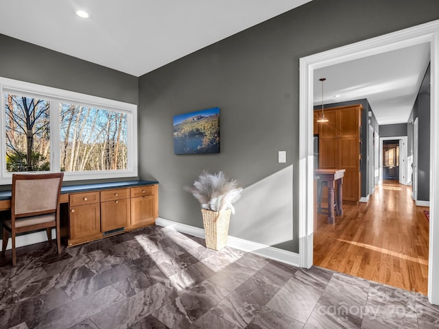 interior space featuring built in desk