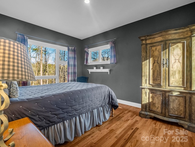 bedroom featuring wood-type flooring