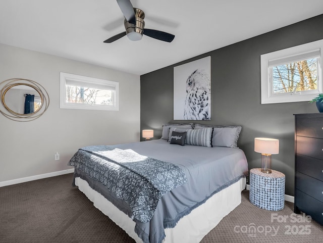 carpeted bedroom with multiple windows and ceiling fan