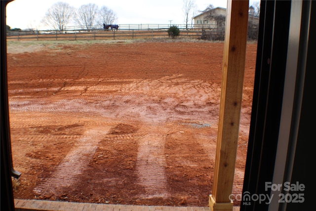 view of yard with a rural view