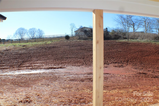 view of yard with a rural view