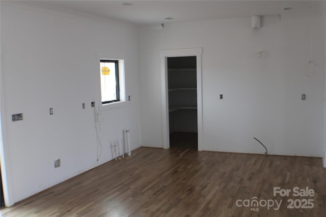 spare room featuring dark hardwood / wood-style floors