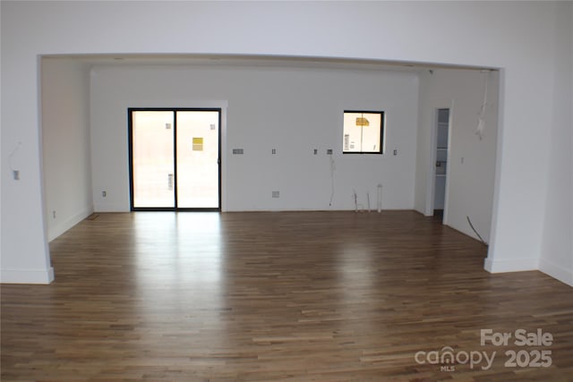 empty room with dark hardwood / wood-style floors