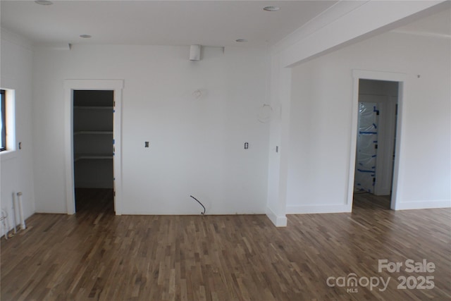 unfurnished room with dark hardwood / wood-style floors