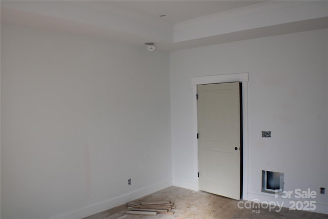 unfurnished room featuring baseboards