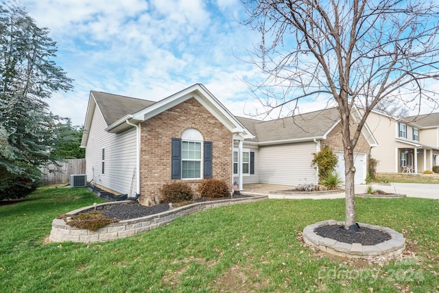 ranch-style house with a front yard, a garage, and central air condition unit