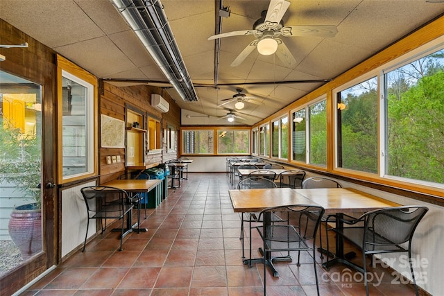 sunroom featuring ceiling fan