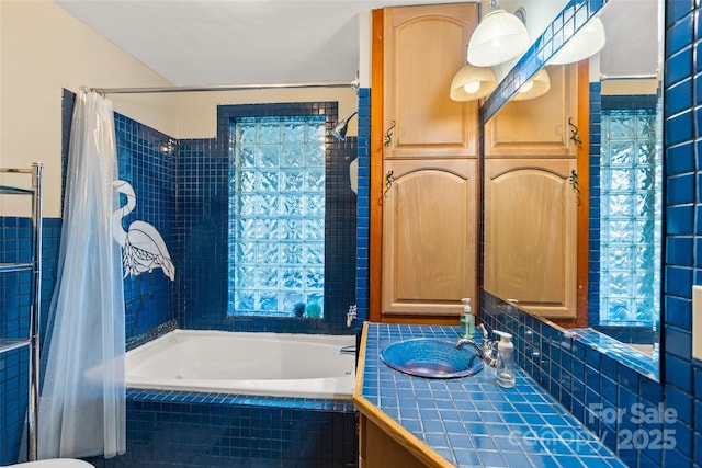 bathroom with shower / tub combo and vanity