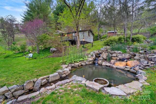 view of yard with a garden pond