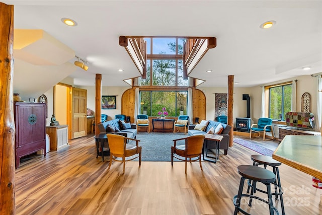 interior space featuring light hardwood / wood-style floors and a wood stove