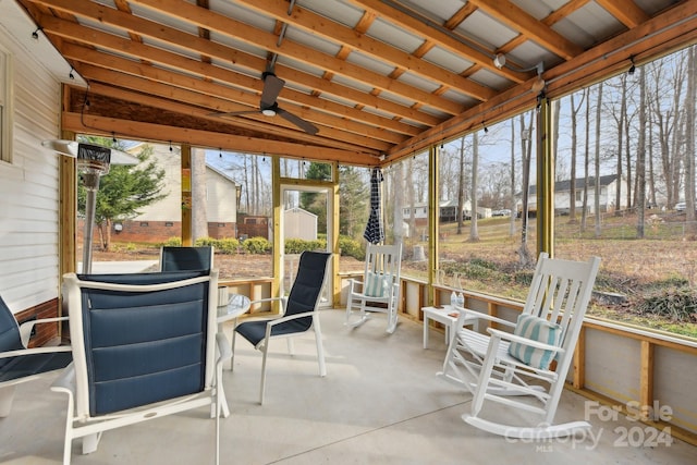 sunroom / solarium featuring ceiling fan and lofted ceiling