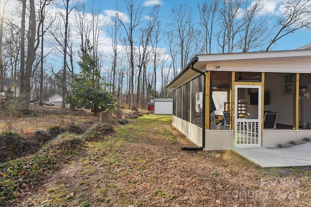 view of yard with a patio area and a sunroom